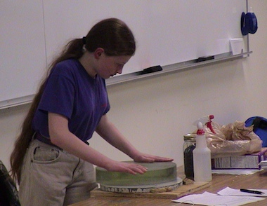Amaryllis and John Dobson working on a telescope mirror